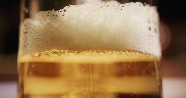 Close Beer Foam Moving Bubbles Cold Light Beer Glass — Stock Video