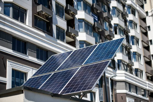 The solar battery panel mounted near modern apartment building in Kyiv, Ukraine. . High quality photo