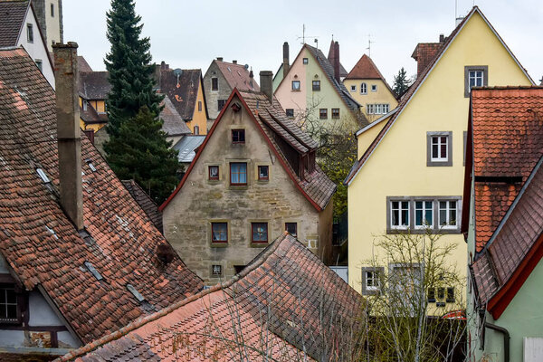 View from town wall of facades and roofs of medieval old town Rothenburg ob der Tauber, Bavaria, Germany.