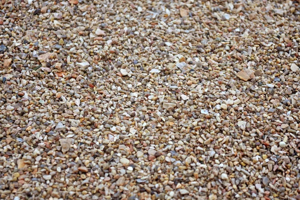 Zee kiezel. Kleurrijke kleine kiezel en stenen textuur. Gedetailleerde zand textuur. — Stockfoto