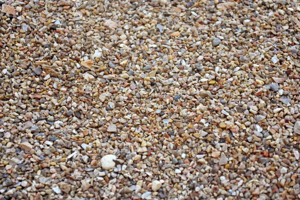 Морской камешек. Красочная мелкая галечная и каменная текстура. Текстура песка . — стоковое фото