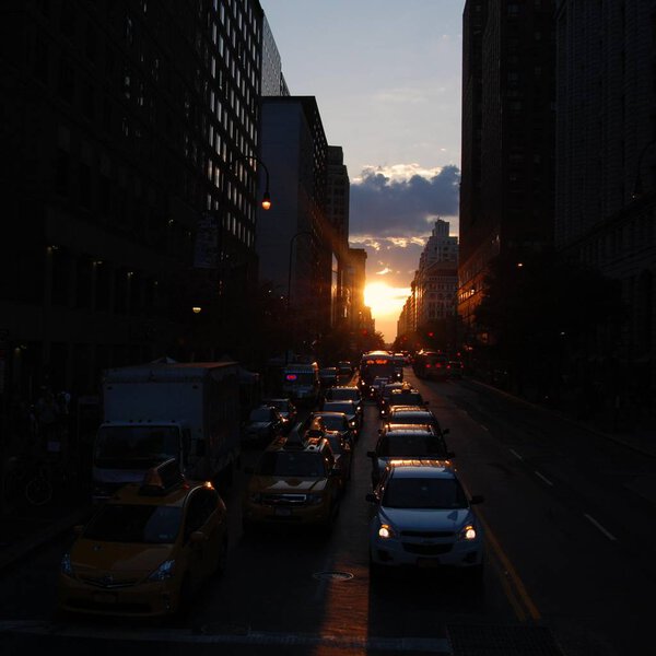 Sunset and busy street street in New York City.