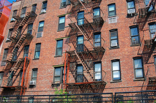 New York brick buildings with fire escape stairs, USA