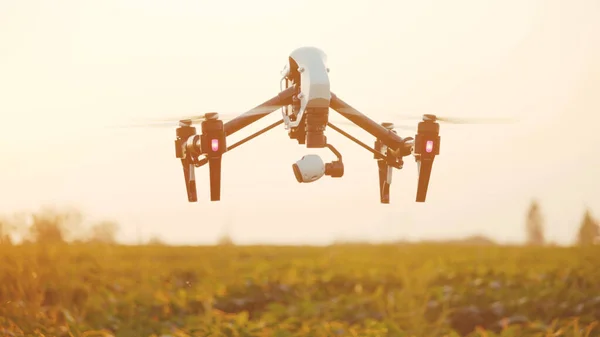 Close up smart agriculture drone flying in sky rural aerial helicopter agros copter farm farming field industry landscape meadow nature plant professional vehicle harvest innovation slow motion