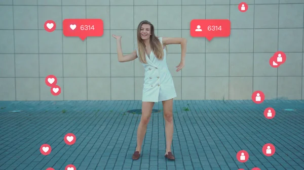 NEW YORK - May 19, 2019: Funny Attractive Dancing Woman Dances. Vlogger Influencer. Animation with User Interface - Likes, Followers, Comments for Social Media from Smartphone. Response. Successful