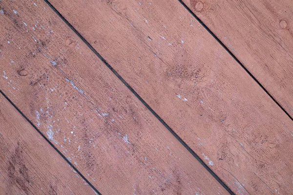 Bir açıyla eski kırmızı tahtalardan arka plan