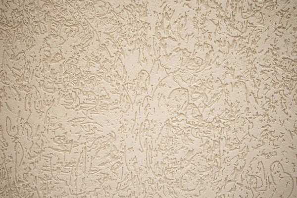 Yellow relief stucco on the wall