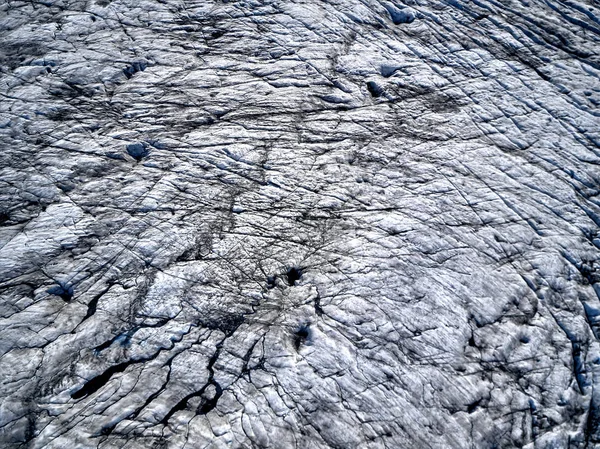 Vista aérea do glaciar de cima, gelo e cinzas do vulcão — Fotografia de Stock