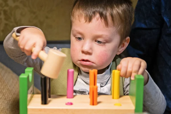 Little Boy Hammering Toy Nails Wooden Board Hammer — Stock Photo, Image