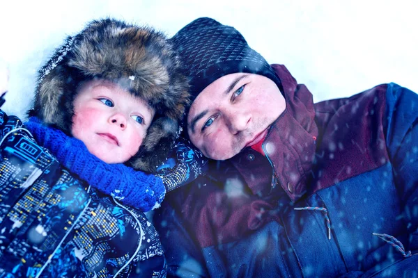 Young Father Son Fur Hat Lie Snow Winter Time Royalty Free Stock Photos