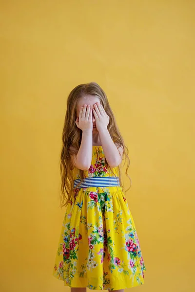 Cheerful Cute Girl Beautiful Dress Closes Her Eyes Her Hands — Stock Photo, Image