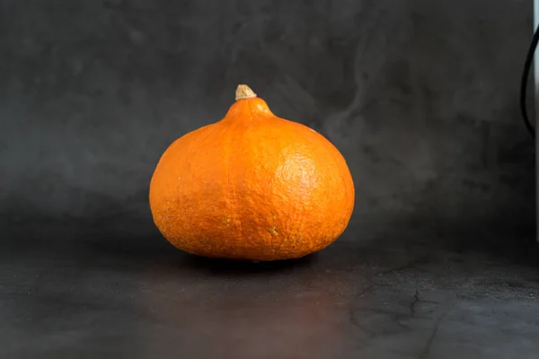 Pumpkin on grey background. Delicious vegetable. The Mood Of Halloween. — Stock Photo, Image