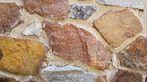 Gray stone wall background. The texture of the stone. Old castle wall background. Stone wall as a background or texture. Part of the wall, for background or texture. — Stock Photo, Image