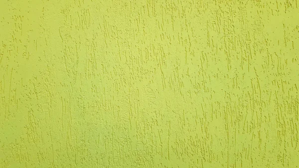 Vecchio oro intonaco parete texture sfondo giallo. Texture intonaco parete strutturata. Decorazione murale in rilievo. Muri di stucco. Decorazione murale in rilievo. intonaco decorativo è dipinto di giallo . — Foto Stock