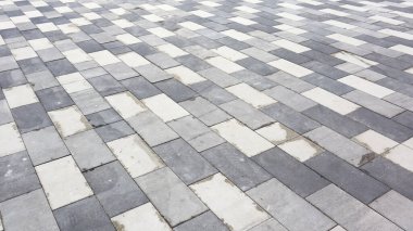 Beton döşeme levhaları. Soyut gri asfalt döşeme dokusu arka planı. Dikdörtgen şeklindeki taşları yakın plan yap.
