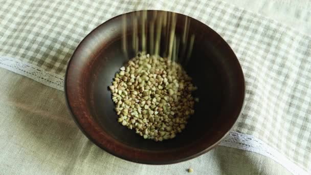 Pour Raw Green Buckwheat Plate Fresh Green Buckwheat Kernels Fall — Stock Video