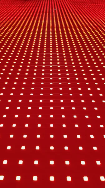 RGB LED screen panel texture. Close-up of a pixel LED screen with bokeh for wallpaper. Bright red abstract background perfect for any design