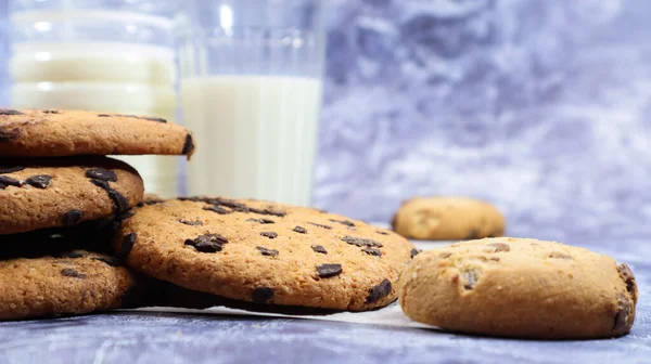 American gluten free chocolate chip cookies with glass glass of vegetable milk on gray background. Chocolate chip cookies. Sweet pastries, dessert. Culinary background