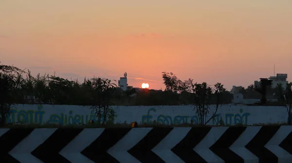 Sunrise through urban area in India