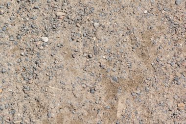 Kumdan, topraktan ve taşlardan oluşan bir arka plan. Parktaki toprağın arkaplanı ve dokusu