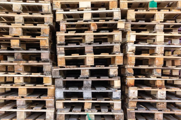 old European pallets stacked against the wall