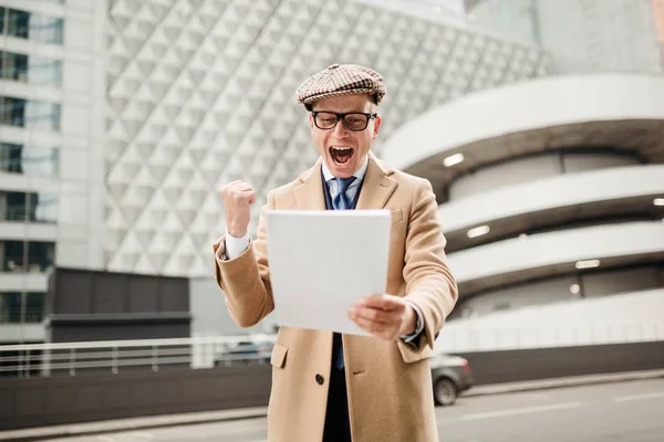 An unemployed man rejoices that he was hired by the company