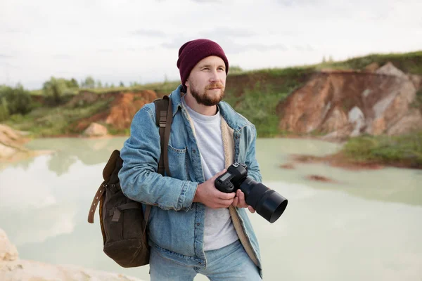 stock image A professional photographer shoots wildlife with his camera