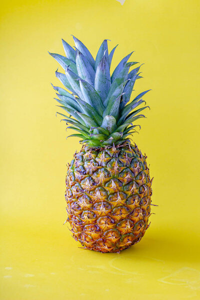 Pineapple with a yellow background 