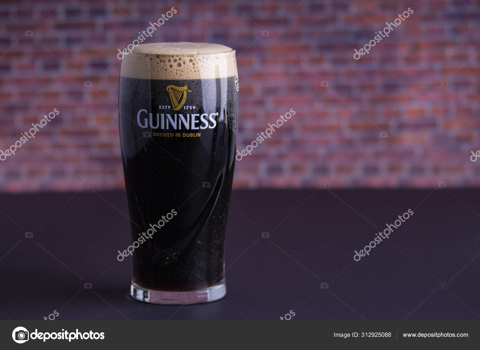 A Guinness dark Irish dry stout beer glass that originated in the