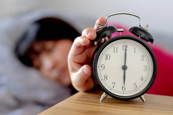 Daylight Saving Time woman waking up