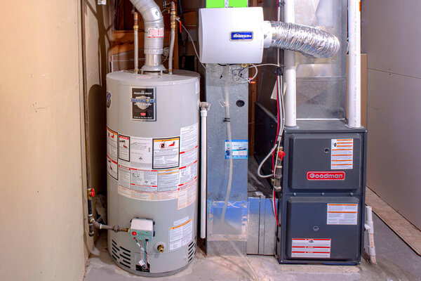Calgary, Alberta, Canada. Sep 21, 2020. A home Goodman high efficiency furnace with Bradford White Residential gas water heater & an Generalaire humidifier.