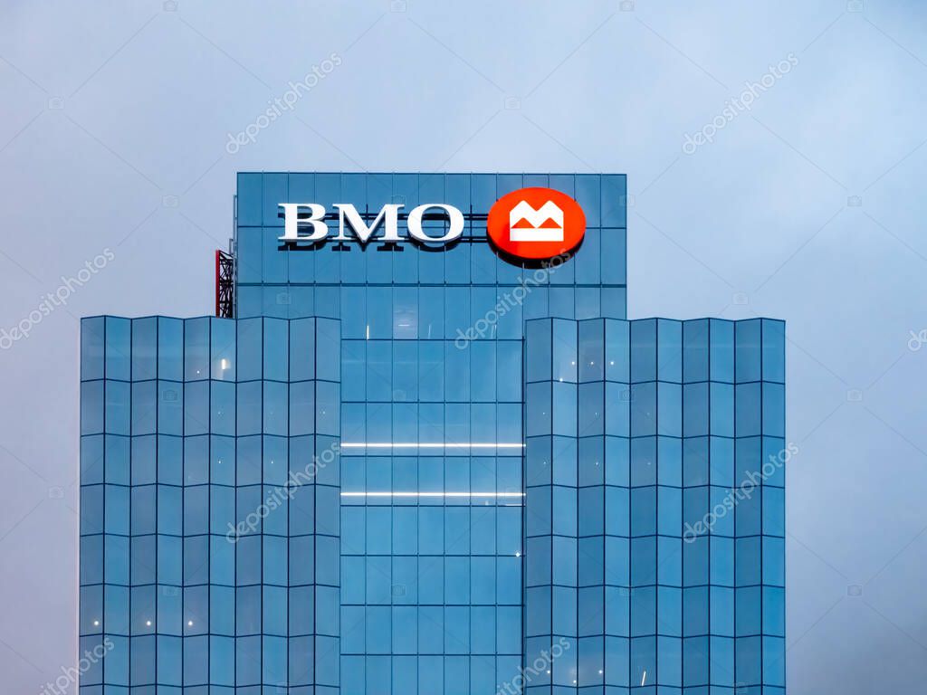 Chicago, Illinois, USA. Sep 15, 2025. A high-angle view of the BMO logo atop a modern glass skyscraper, symbolizing the Bank of Montreal's corporate presence and financial strength.