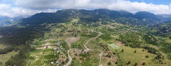 A bird's-eye view of the small village in the magnificent nature. Drone view of village.