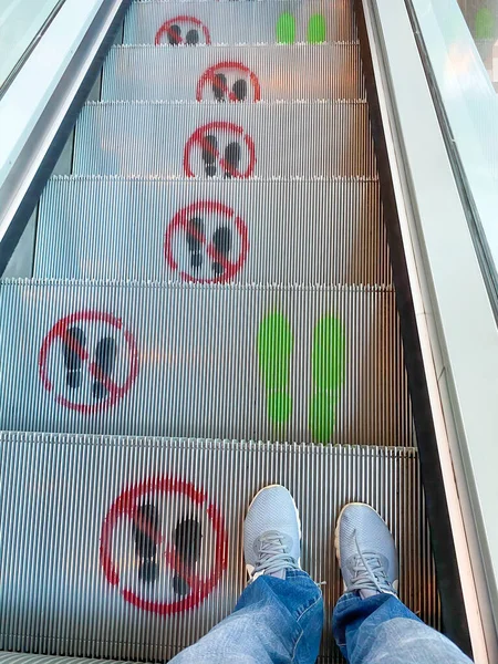 Social distance signs on the stairs walking due to coronavirus