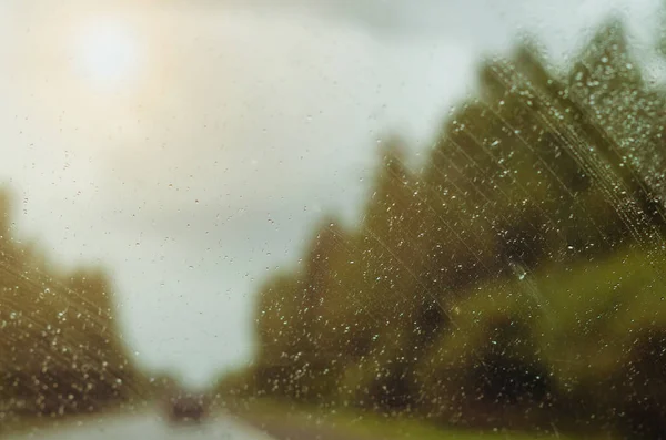Drops of rain on a car window.Autumn downpours.