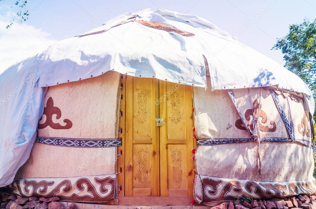 A beautiful yurt under a tent close up