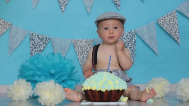 Little Baby Boy Celebrating His First Birthday Smash Cake Party