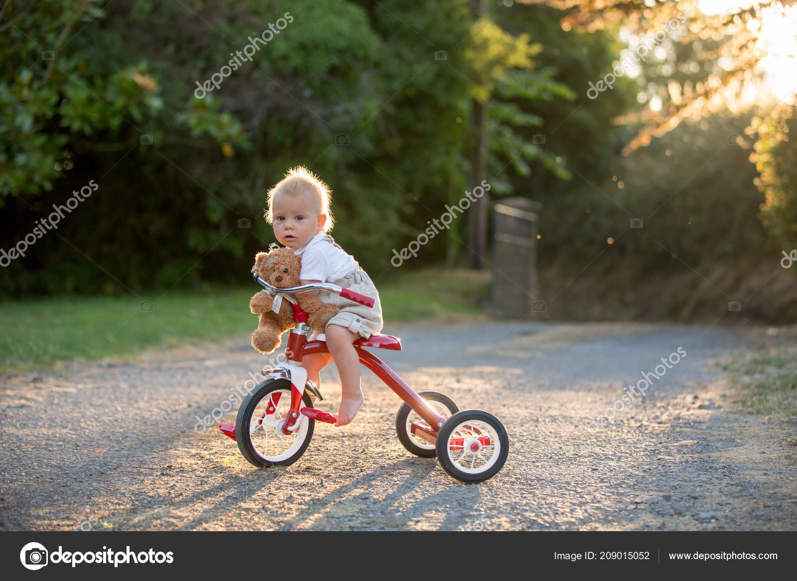 toddler riding tricycle