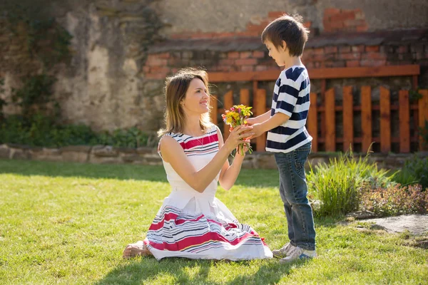 Cute Little Boy Giving Present His Mom Mothers Day Garden — Stock Photo, Image