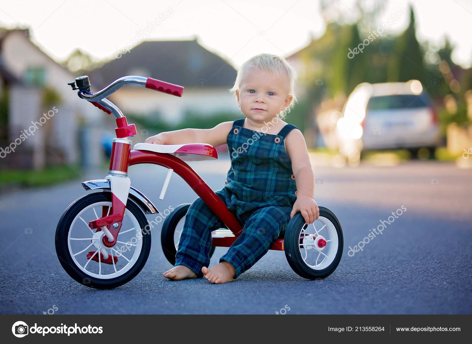 toddler riding tricycle