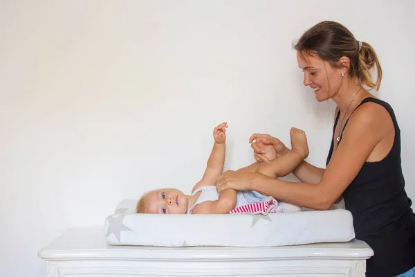 Happy Mother Playing Baby While Changing His Diaper Smiling Young — Stock Photo, Image