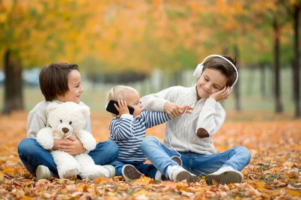 Portrait Adorable Children Brothers Autumn Park Listening Music Playing Mobile — Stock Photo, Image