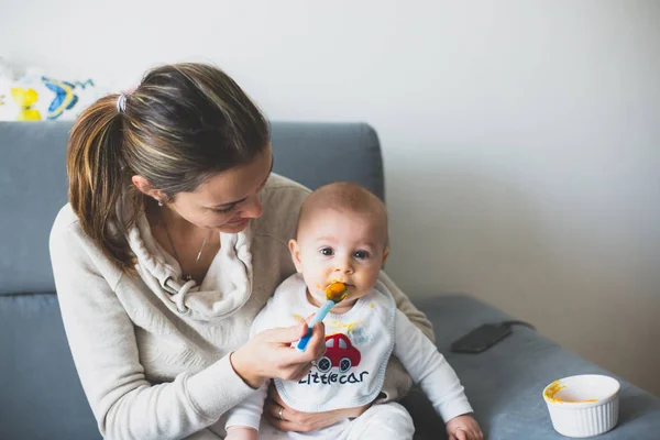 Mother Feeding Her Baby Boy Mashed Pumpking First Time — Stock Photo, Image
