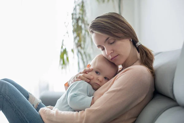 Young Mother Holding Her Sick Toddler Boy Hugging Him Home — Stock Photo, Image