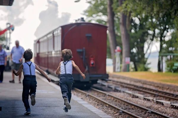 Beautiful children, dressed in vintage clothes, enjoying old ste — Stock Photo, Image