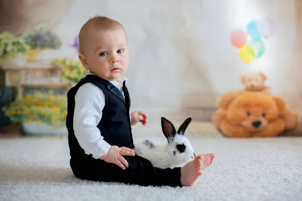 Cute little toddler boy, dressed smart casual, playing with litt — Stock Photo, Image