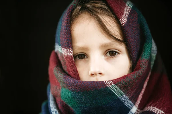 Close up of a child with a scarf wrapped over and around the hea — Stock Photo, Image