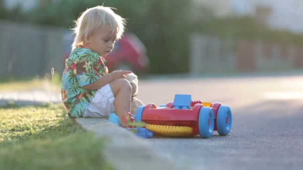 Beautiful Toddler Child Playing Plastic Toys Blocks Cars Sunset Small — Stock Video