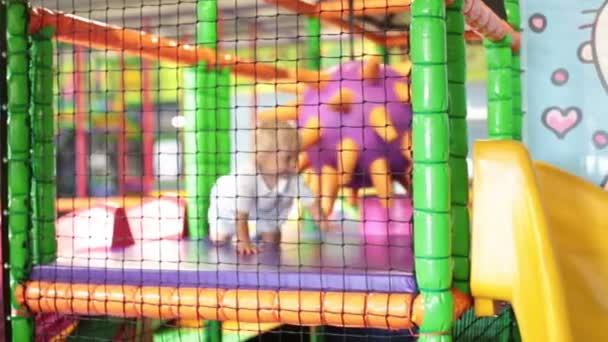 Little Toddler Child Boy Playing Children Playground Indoors Kid Plays — Stock Video