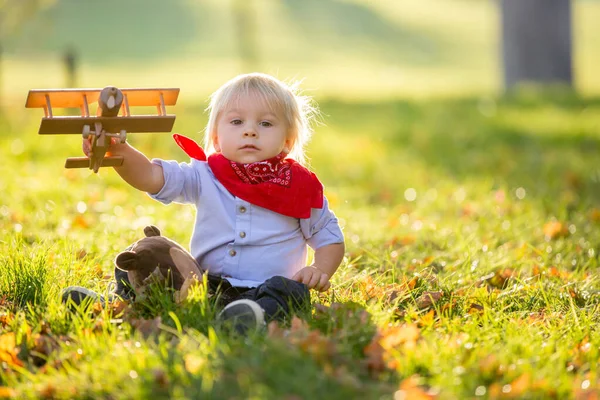Beautiful blonde two years old toddler boy, playing with wooden — Stock Photo, Image
